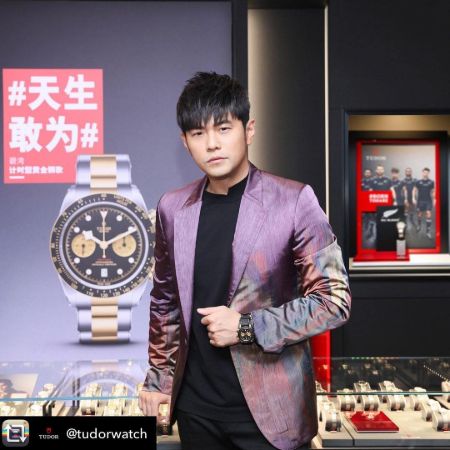 Jay Chou in a purple blazer promoting Tudor Watch.